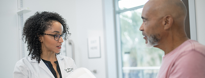 Female doctor talking to patient.